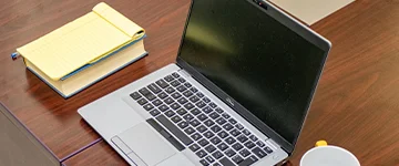 Front view of a laptop and notebook