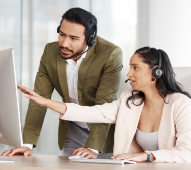 Man and women in a call center showing their experience - Seguros Confie, Best Call Center in Tijuana.